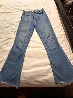 PAIGE Light Blue Flared Jeans with Frayed Hem